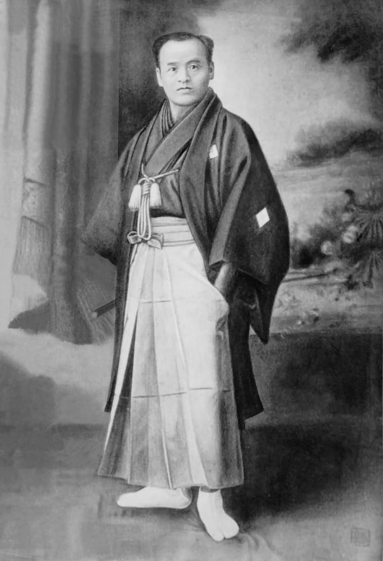 A black-and-white portrait photograph of Takeda Sōkaku, the documented founder of Daitō-ryū Aiki-jūjutsu.