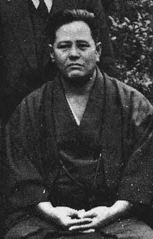 A black-and-white portrait photograph of Miyagi Chōjun, founder of Gōjū-ryū.