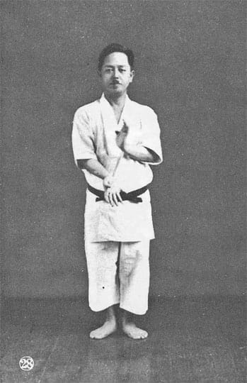 A black-and-white portrait photograph of Mabuni Kenwa, founder of Shitō-ryū.
